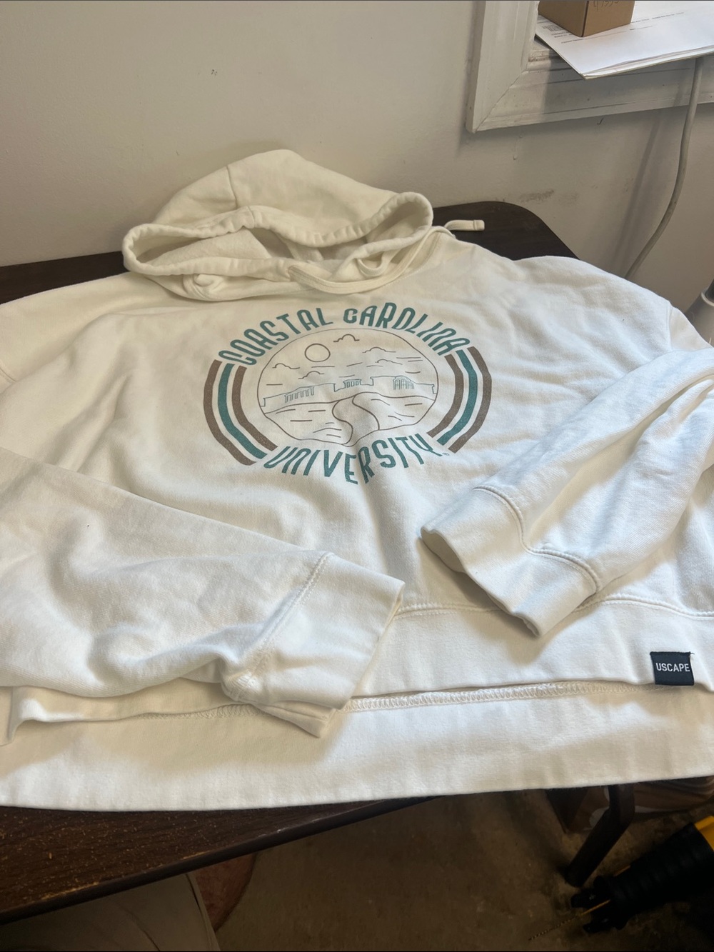 NCAA Cream Cropped Hoodie with Teal & Brown Coastal Graphic